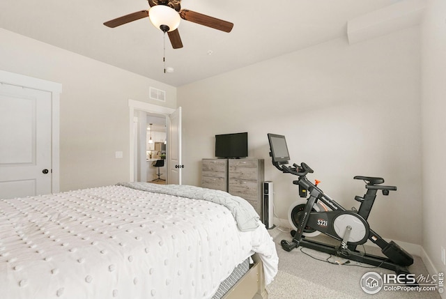 bedroom with visible vents, baseboards, and ceiling fan