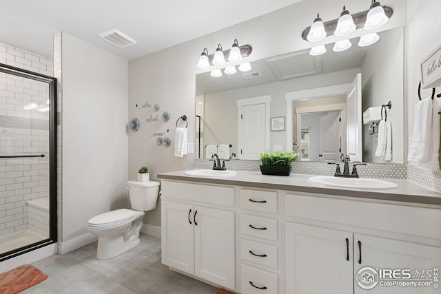 full bathroom with a sink, visible vents, toilet, and a stall shower
