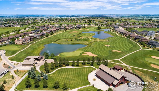 birds eye view of property featuring a water view, golf course view, and a residential view