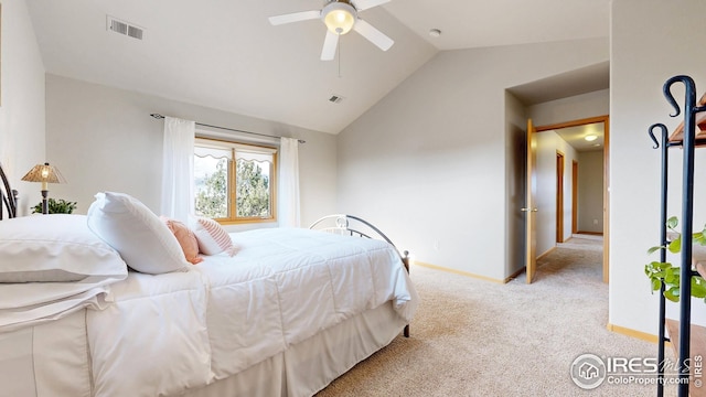 carpeted bedroom with baseboards, vaulted ceiling, and visible vents