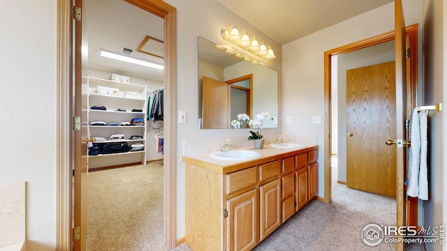 full bathroom with double vanity, a sink, and visible vents