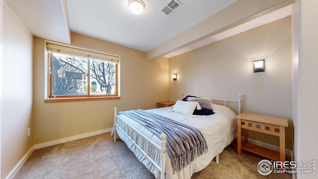 bedroom with carpet flooring, baseboards, and visible vents