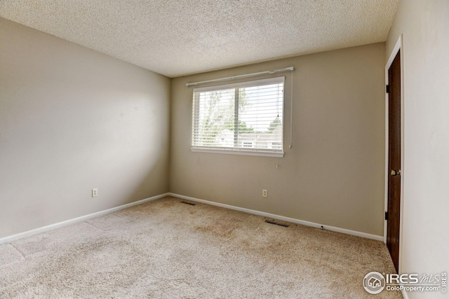 2924 Ross Dr Unit H20, Fort Collins, CO 80526 - carpeted spare room featuring visible vents, a textured ceiling, and baseboards