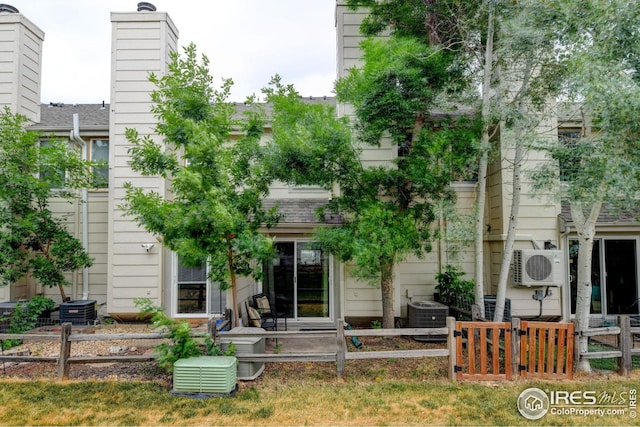 2924 Ross Dr Unit H20, Fort Collins, CO 80526 - rear view of house with ac unit, fence, and cooling unit
