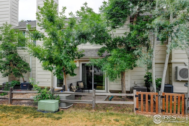 2924 Ross Dr Unit H20, Fort Collins, CO 80526 - rear view of house featuring central AC, fence, and ac unit