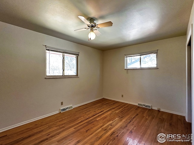 1401 Constitution Ave, Fort Collins, CO 80521 - unfurnished bedroom with visible vents, baseboards, a ceiling fan, and wood finished floors