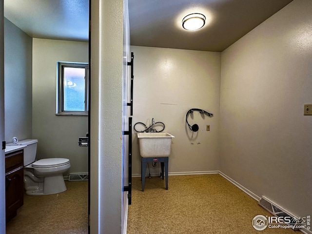 1401 Constitution Ave, Fort Collins, CO 80521 - bathroom with toilet, vanity, and baseboards