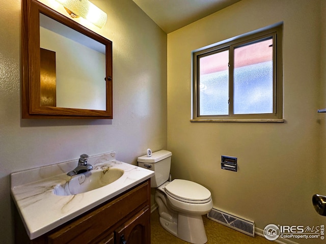 1401 Constitution Ave, Fort Collins, CO 80521 - half bath with vanity, visible vents, and toilet