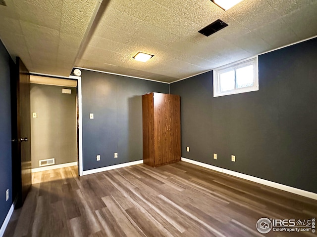 1401 Constitution Ave, Fort Collins, CO 80521 - interior space featuring visible vents, baseboards, a textured ceiling, and wood finished floors