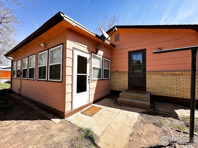 1401 Constitution Ave, Fort Collins, CO 80521 - rear view of property with brick siding and entry steps