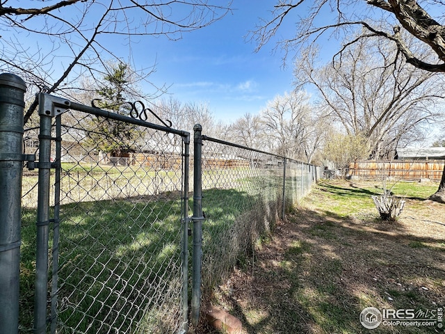 1401 Constitution Ave, Fort Collins, CO 80521 - view of yard with fence and a gate