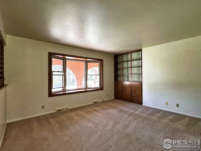 1401 Constitution Ave, Fort Collins, CO 80521 - unfurnished room featuring carpet flooring, visible vents, and baseboards