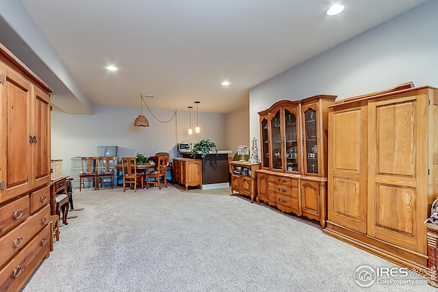 office space with light carpet and recessed lighting