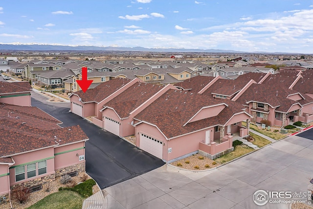 aerial perspective of suburban area with a mountain backdrop