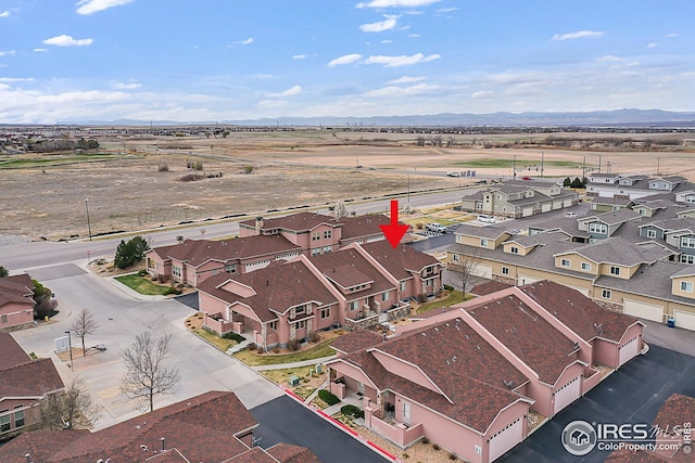 aerial perspective of suburban area featuring a mountain backdrop