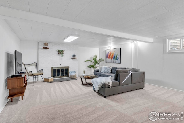 living room featuring carpet and a brick fireplace