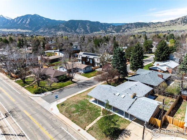 birds eye view of property featuring a mountain view and a residential view