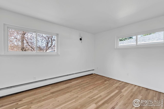 basement featuring a baseboard radiator and carpet floors