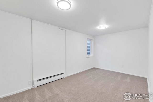 finished basement with a baseboard radiator and independent washer and dryer