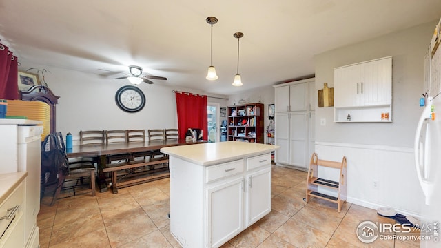 2706 Balmoral Ct, Fort Collins, CO 80525 - kitchen featuring light countertops, ceiling fan, freestanding refrigerator, and white cabinets