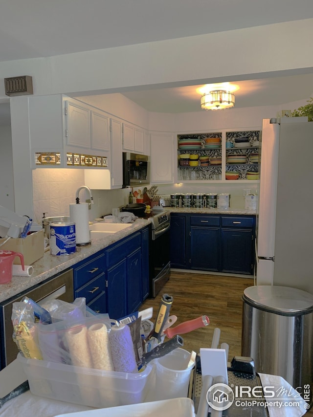 198 Poudre River Rd, Bellvue, CO 80512 - kitchen featuring a sink, appliances with stainless steel finishes, white cabinetry, light countertops, and blue cabinets