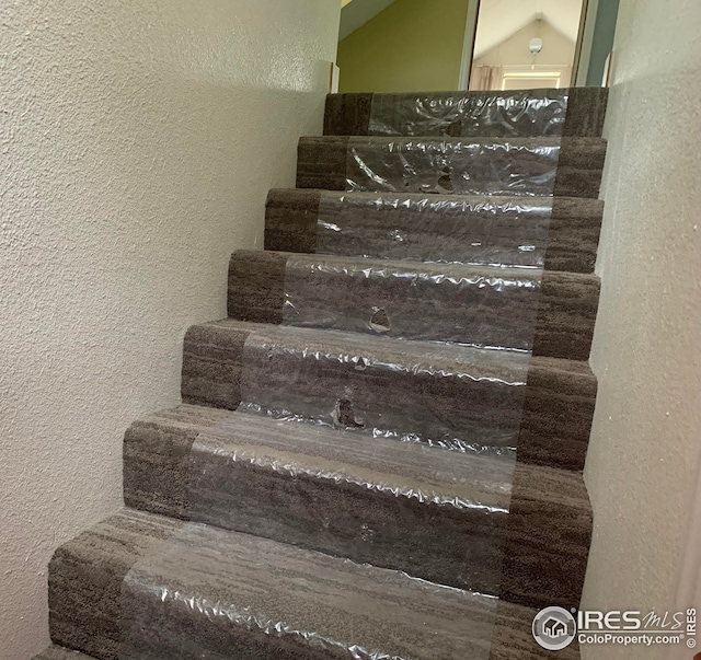 198 Poudre River Rd, Bellvue, CO 80512 - staircase featuring a textured wall