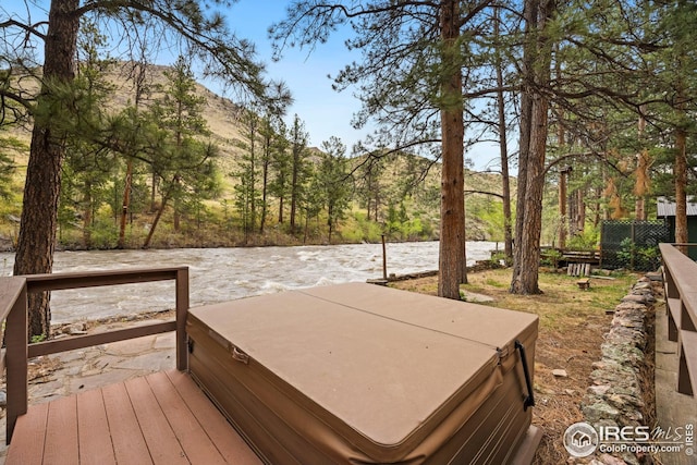 198 Poudre River Rd, Bellvue, CO 80512 - wooden deck with fence, a mountain view, and a hot tub