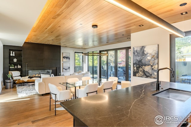 interior space featuring wooden ceiling and light wood finished floors