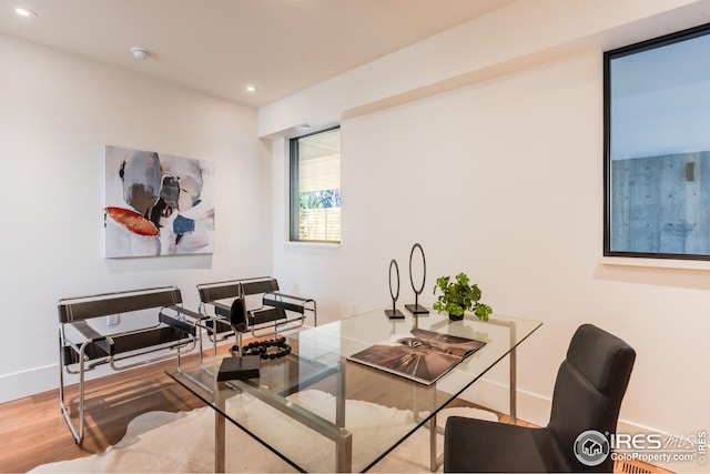 home office with baseboards, wood finished floors, and recessed lighting
