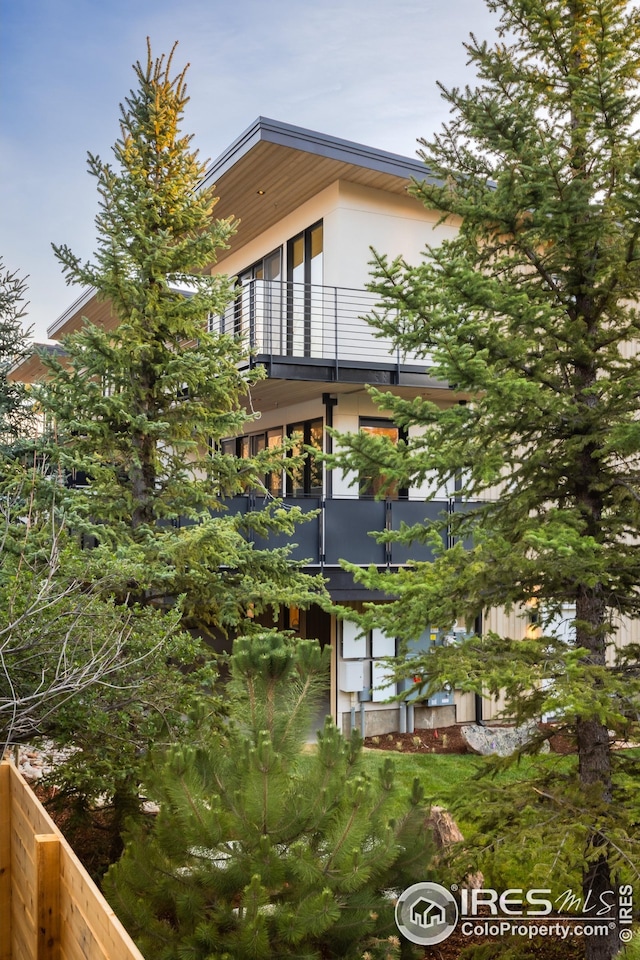 view of property exterior with a balcony