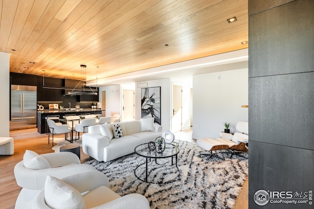 living room featuring wood ceiling and light wood-style flooring