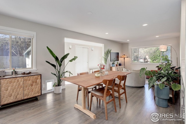 dining space with recessed lighting and wood finished floors