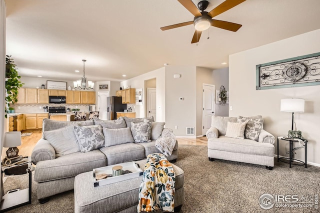 273 Mt Harvard Ave, Severance, CO 80550 - living area featuring visible vents, baseboards, recessed lighting, light wood finished floors, and ceiling fan with notable chandelier
