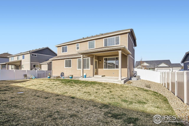273 Mt Harvard Ave, Severance, CO 80550 - rear view of house with a patio, a fenced backyard, and a yard