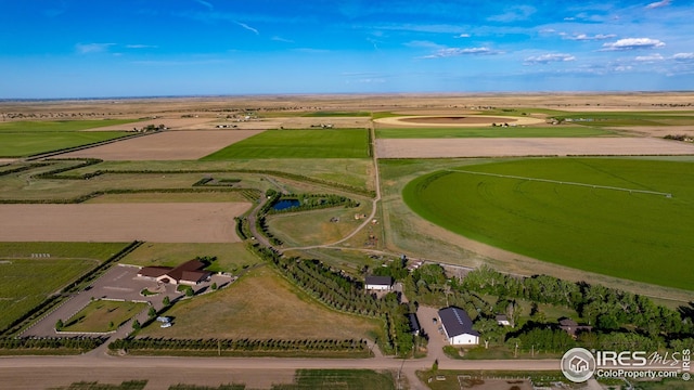 birds eye view of property with a rural view
