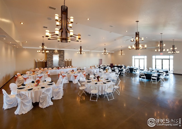 miscellaneous room featuring visible vents, a chandelier, concrete flooring, recessed lighting, and vaulted ceiling