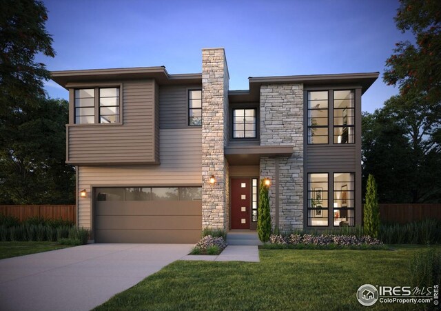 contemporary home featuring a garage, a front yard, fence, stone siding, and driveway