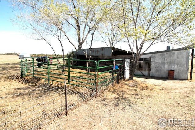 view of yard featuring an outbuilding and an exterior structure