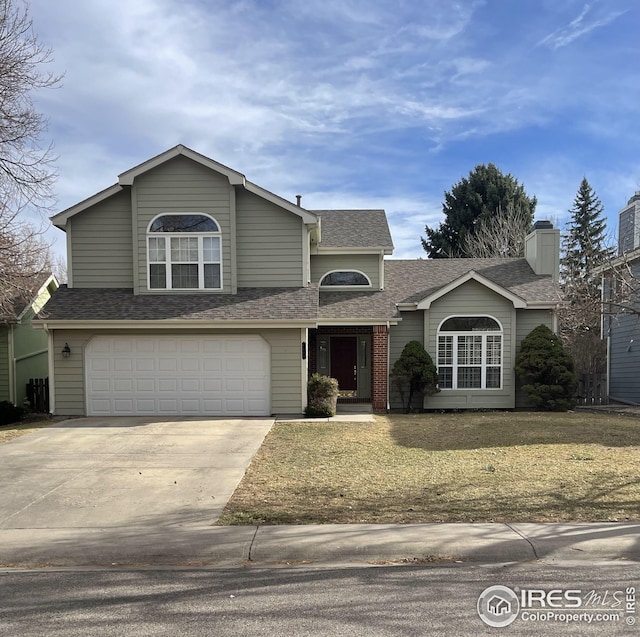 traditional-style home with an attached garage, a shingled roof, driveway, and a front lawn