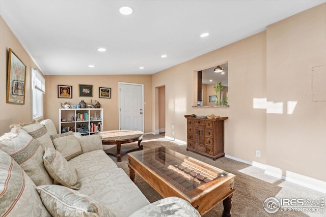 carpeted living room featuring recessed lighting and baseboards