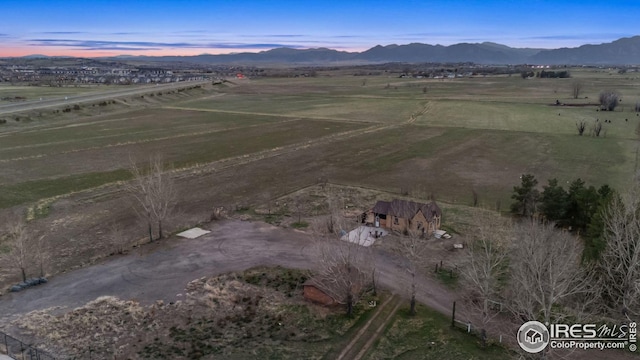 aerial view with a mountain view and a rural view