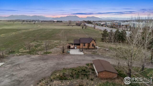 birds eye view of property with a rural view and a mountain view