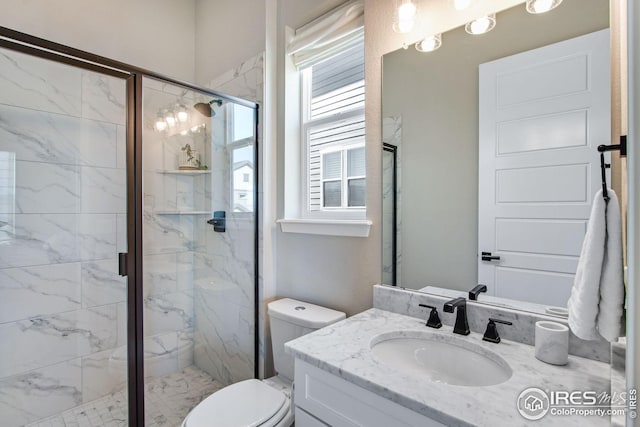 16335 Spanish Peak Way, Broomfield, CO 80023 - bathroom with toilet, vanity, and a marble finish shower
