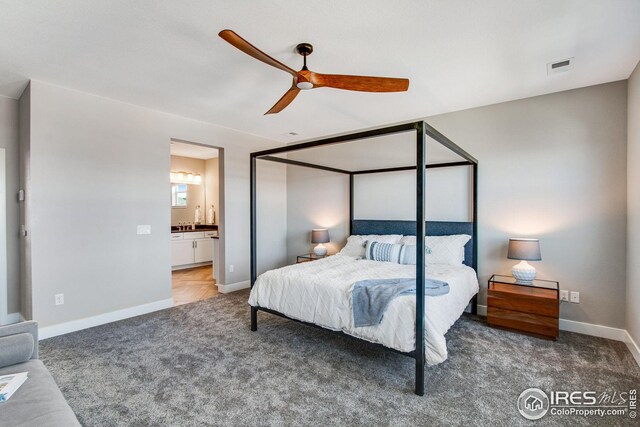 16335 Spanish Peak Way, Broomfield, CO 80023 - bedroom featuring ceiling fan, carpet floors, baseboards, ensuite bath, and visible vents