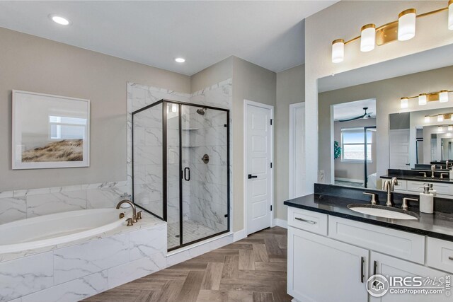16335 Spanish Peak Way, Broomfield, CO 80023 - full bath featuring a bath, recessed lighting, vanity, and a stall shower