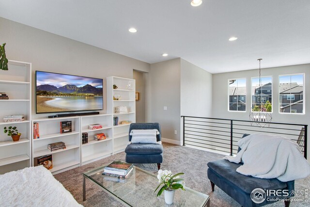 16335 Spanish Peak Way, Broomfield, CO 80023 - carpeted living room with a chandelier, baseboards, and recessed lighting