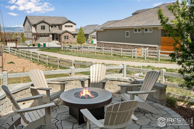 16335 Spanish Peak Way, Broomfield, CO 80023 - view of patio with fence and an outdoor fire pit