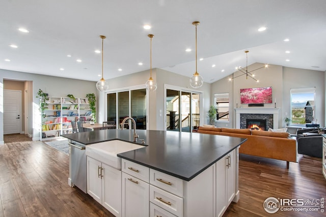 16335 Spanish Peak Way, Broomfield, CO 80023 - kitchen featuring recessed lighting, dark countertops, dark wood-style floors, and a sink