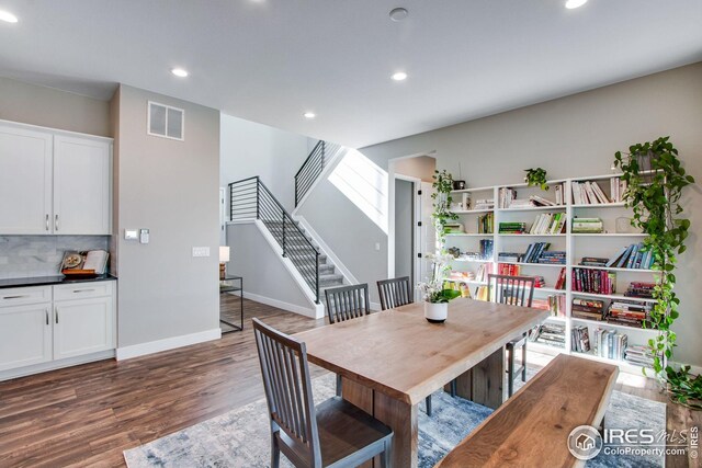 16335 Spanish Peak Way, Broomfield, CO 80023 - dining room featuring stairway, wood finished floors, baseboards, visible vents, and recessed lighting
