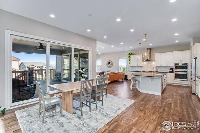 16335 Spanish Peak Way, Broomfield, CO 80023 - dining area with recessed lighting, dark wood-style floors, and ceiling fan